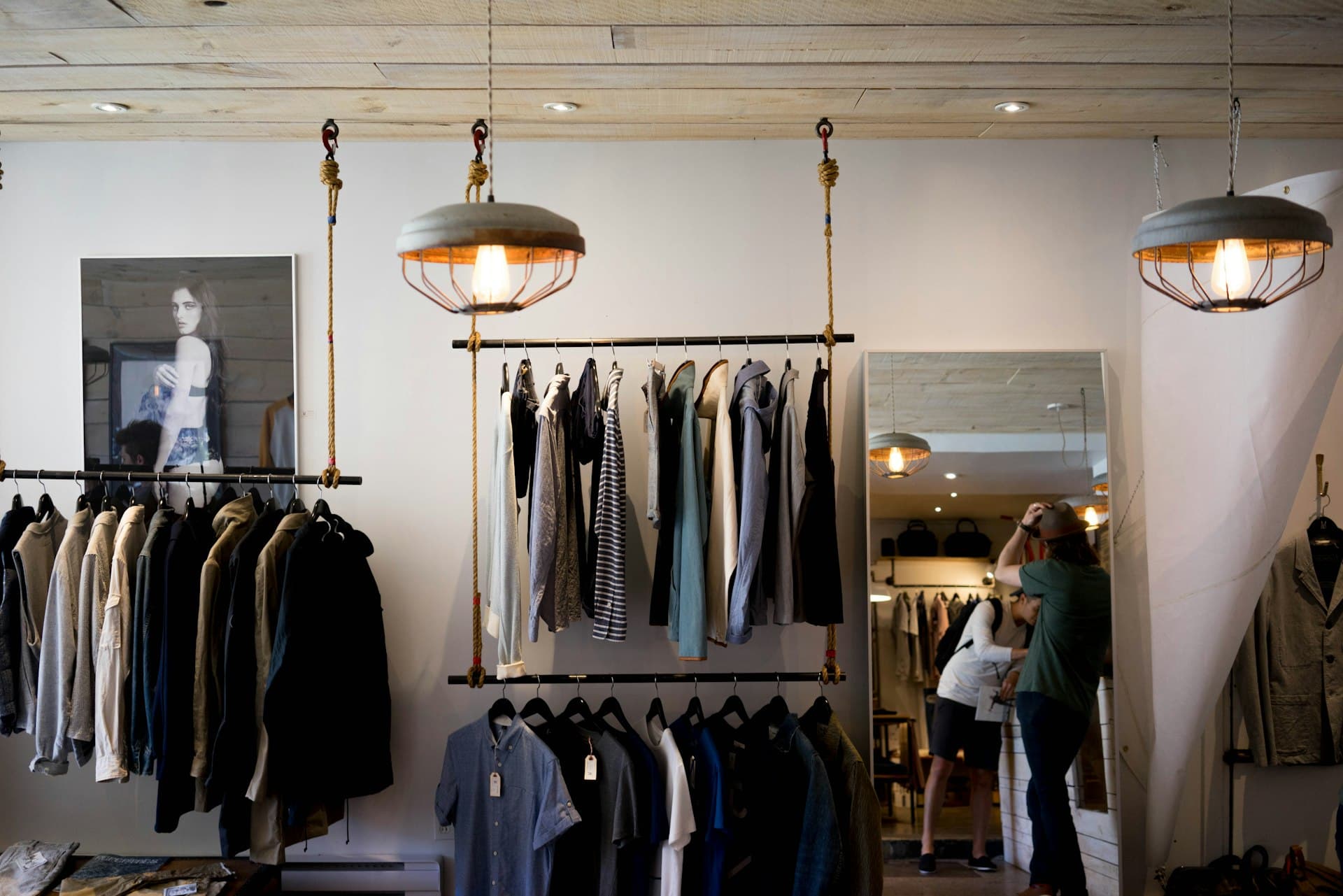 Independent apparel store interior with hanging racks