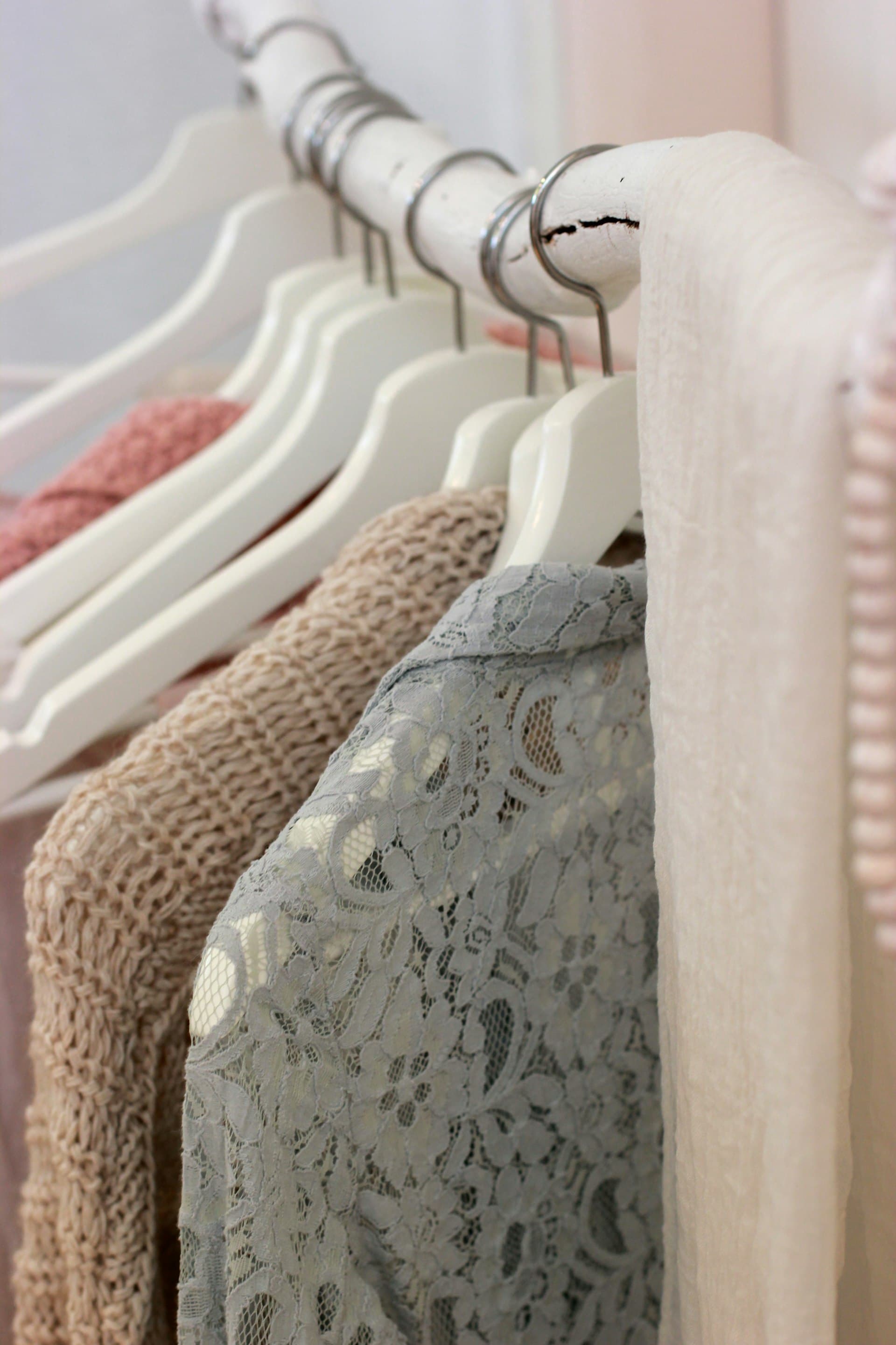 Soft lace garments on white hangers
